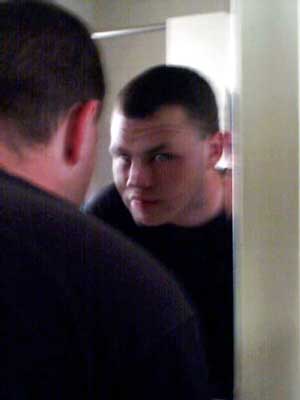 Looking into the bathroom mirror after work (c. May 2001).
